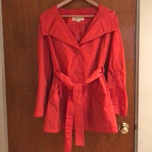 Orange Michael Kors belted raincoat